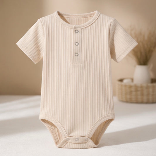 Ribbed organic cotton baby bodysuit in neutral beige minimalist baby clothing